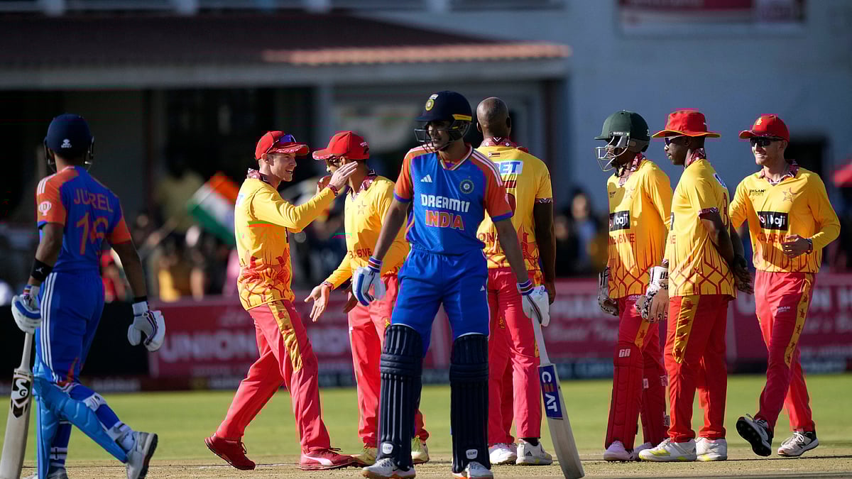 (AP Photo/Tsvangirayi Mukwazhi) : Zimbabwe players celebrate a wicket during the T20 cricket match against India at Harare Sports club, Saturday, July 6, 2024.

